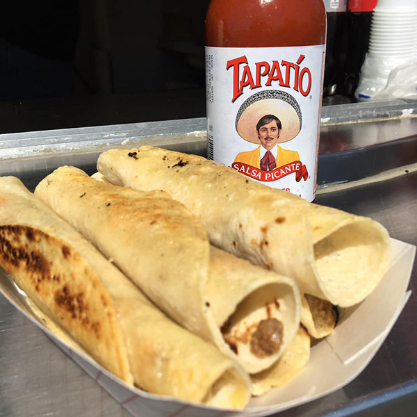 rolled tacos with tapatio in the background dixon may fair